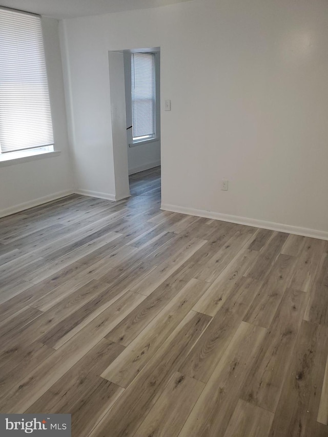 unfurnished room with light hardwood / wood-style flooring