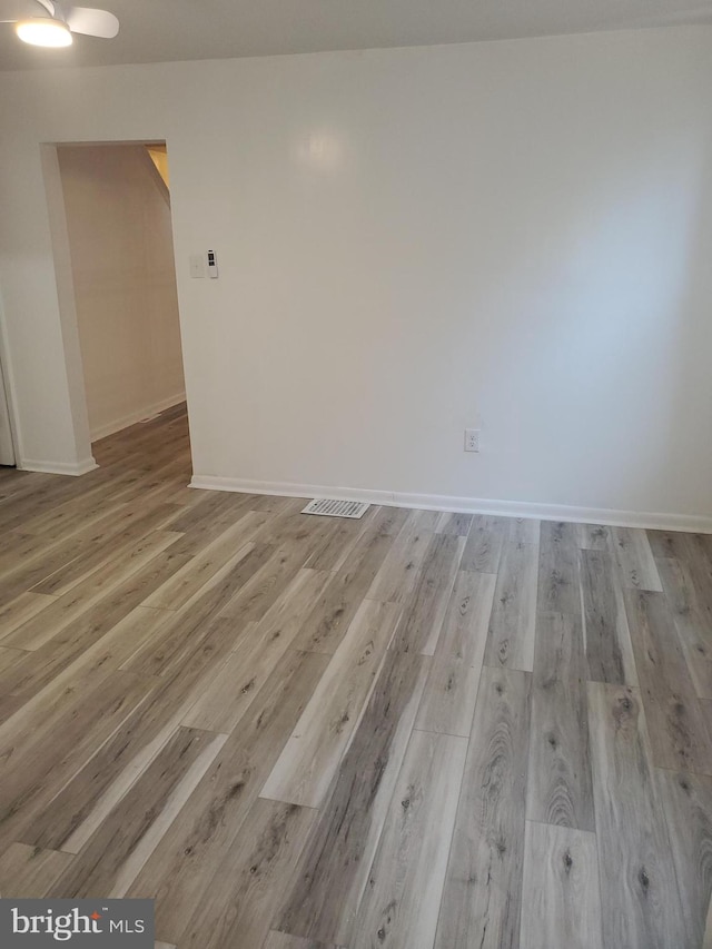 unfurnished room with light hardwood / wood-style flooring