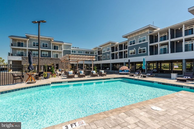 view of swimming pool with a pergola and a patio area