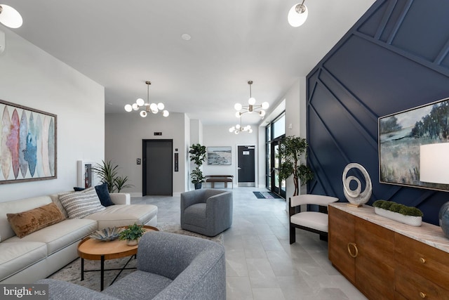 living room featuring an inviting chandelier and light tile patterned floors