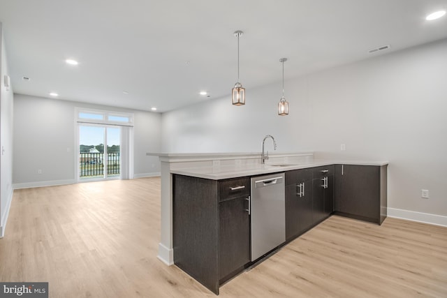 kitchen featuring dark brown cabinets, light hardwood / wood-style floors, sink, and stainless steel dishwasher