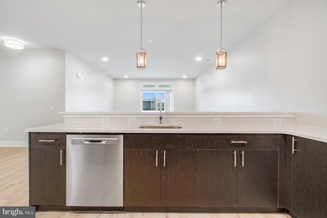 kitchen featuring dark brown cabinets, dishwasher, light hardwood / wood-style floors, and sink