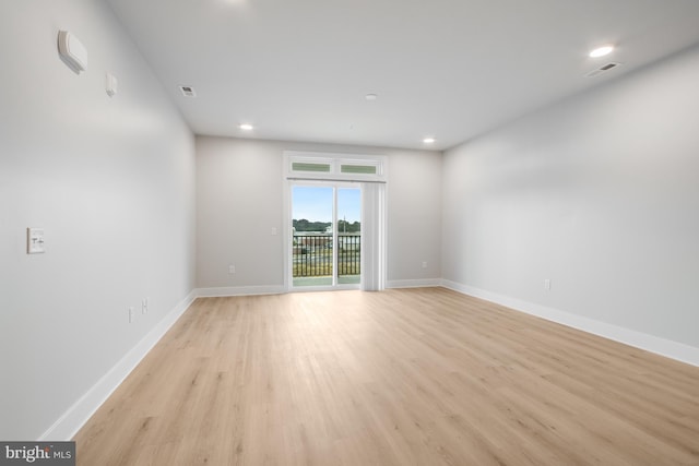 unfurnished room featuring light hardwood / wood-style floors