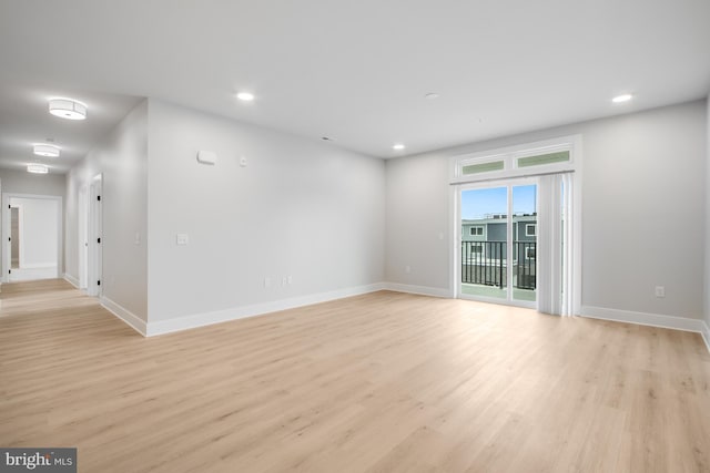 unfurnished room with light hardwood / wood-style floors