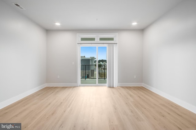 spare room featuring light hardwood / wood-style flooring