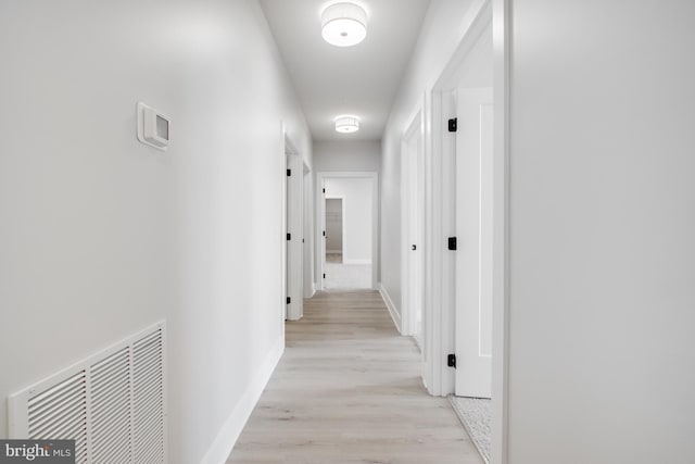 corridor featuring light hardwood / wood-style flooring