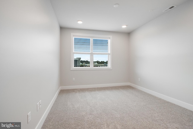 empty room with carpet flooring