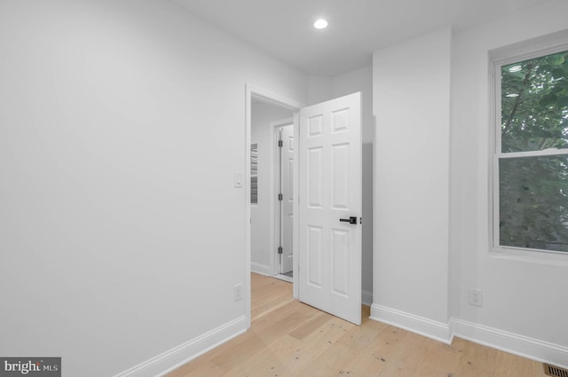 unfurnished room featuring light wood-type flooring