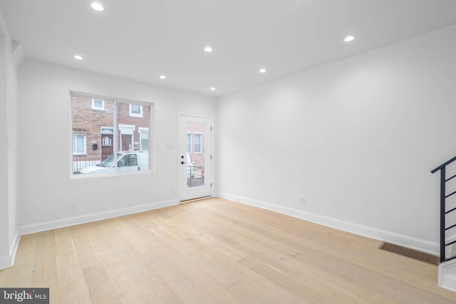 unfurnished living room with light hardwood / wood-style floors