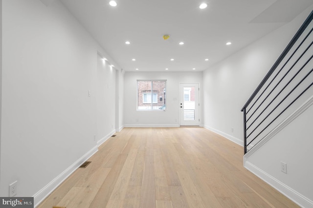 unfurnished living room featuring light hardwood / wood-style flooring