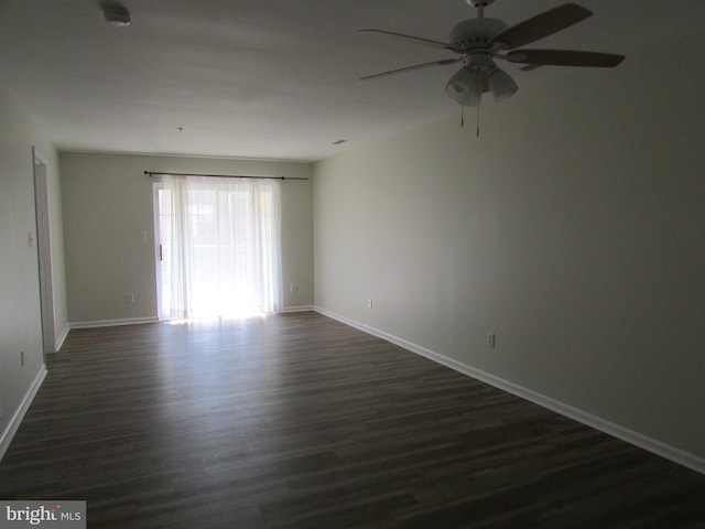 unfurnished room featuring dark hardwood / wood-style flooring and ceiling fan