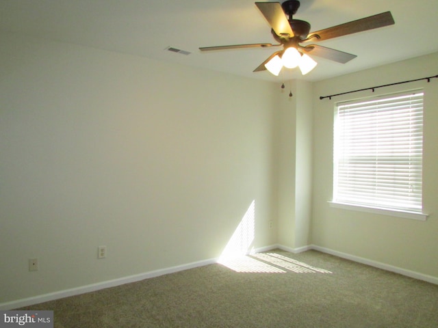 carpeted empty room with ceiling fan