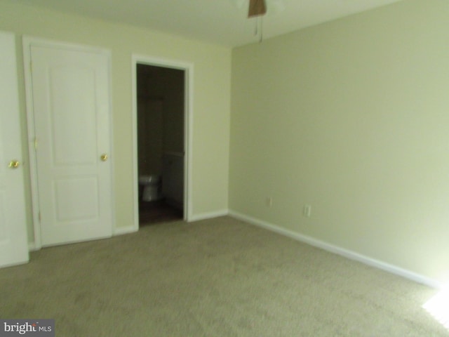 unfurnished bedroom featuring light colored carpet