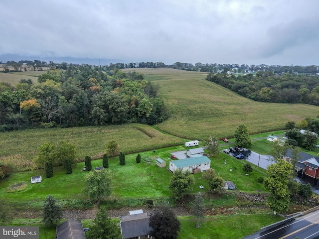 birds eye view of property with a rural view