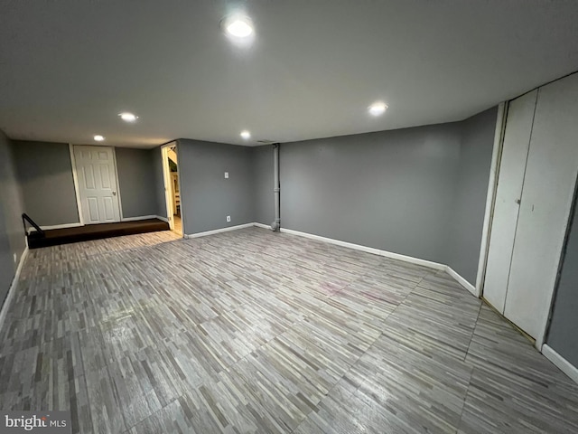 basement featuring wood-type flooring