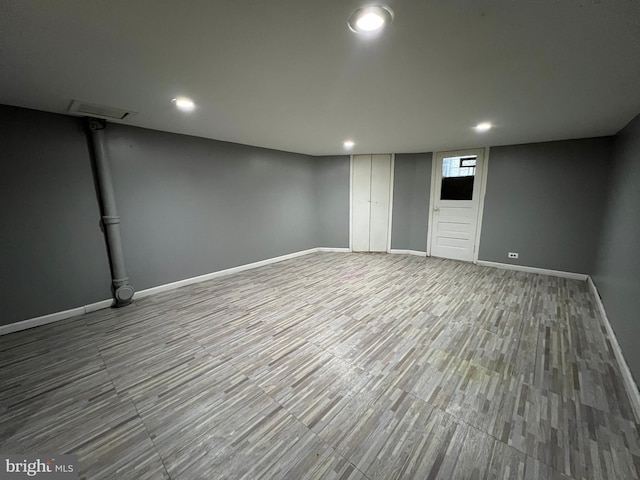 basement featuring hardwood / wood-style flooring