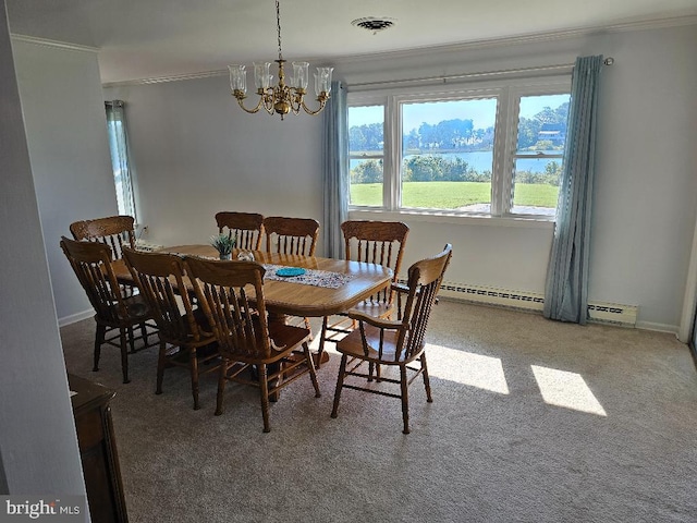 dining space featuring carpet, a chandelier, and crown molding