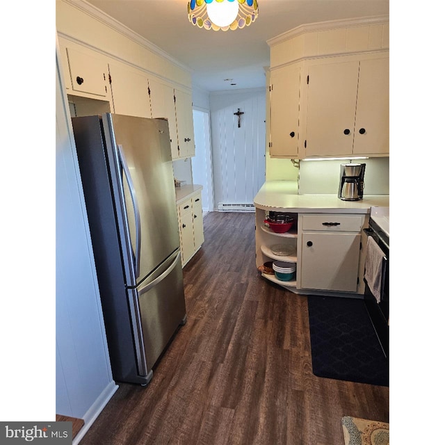 kitchen featuring baseboard heating, stainless steel refrigerator, white cabinetry, and dark hardwood / wood-style flooring