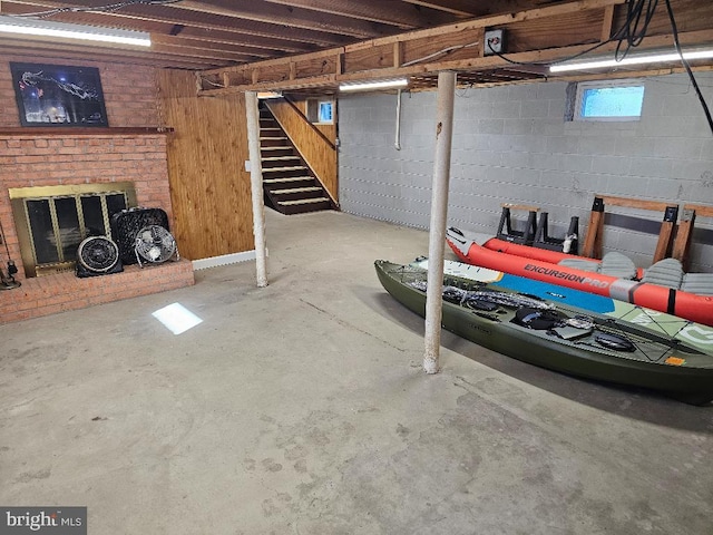 basement with a brick fireplace