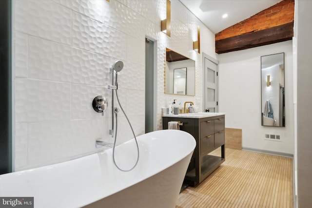 bathroom featuring vanity, vaulted ceiling, and plus walk in shower