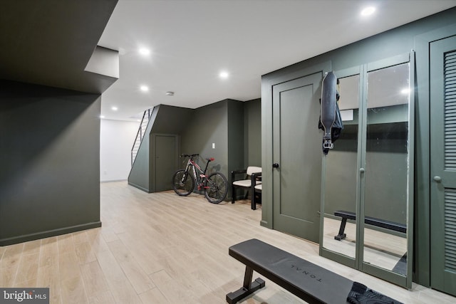 workout area featuring light hardwood / wood-style floors