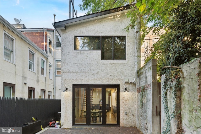 back of property featuring french doors