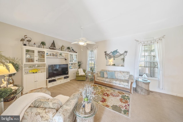 living room with ceiling fan and light carpet