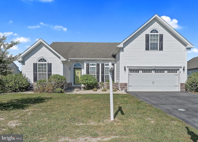 view of front facade featuring a garage and a front lawn