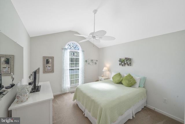 bedroom with lofted ceiling, light colored carpet, and ceiling fan