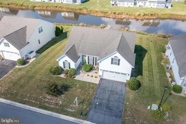 birds eye view of property with a water view