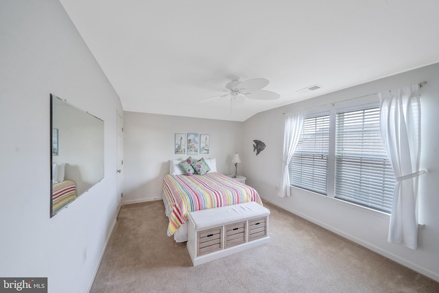 carpeted bedroom with lofted ceiling and ceiling fan