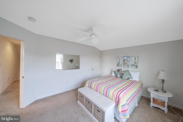 bedroom with light carpet, ceiling fan, and vaulted ceiling