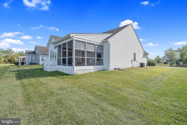 view of home's exterior with central air condition unit, a sunroom, and a lawn