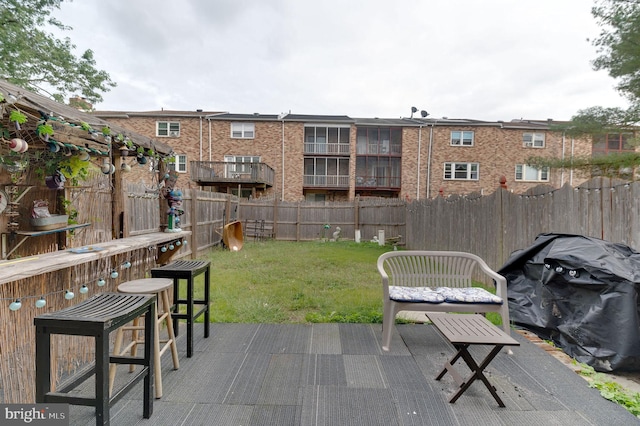 view of patio / terrace with area for grilling and exterior bar