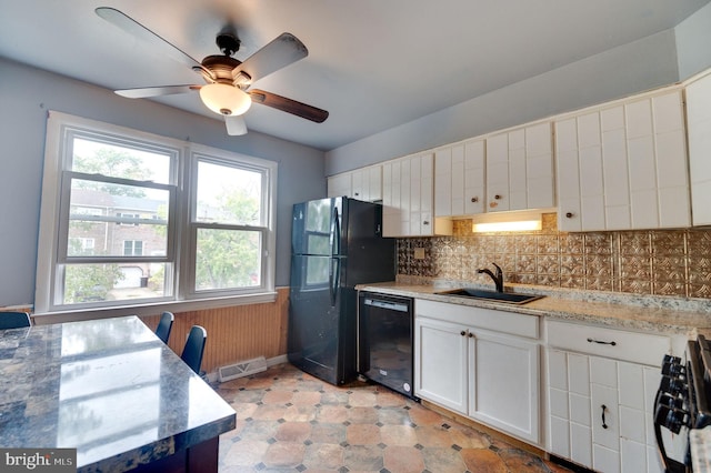 kitchen featuring black appliances, white cabinets, sink, ceiling fan, and decorative backsplash