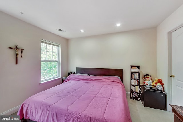 bedroom with light colored carpet