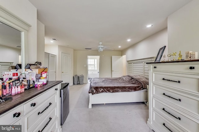 bedroom featuring ceiling fan and light colored carpet