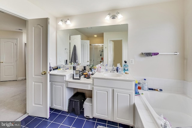 bathroom with vanity, tile patterned floors, and separate shower and tub