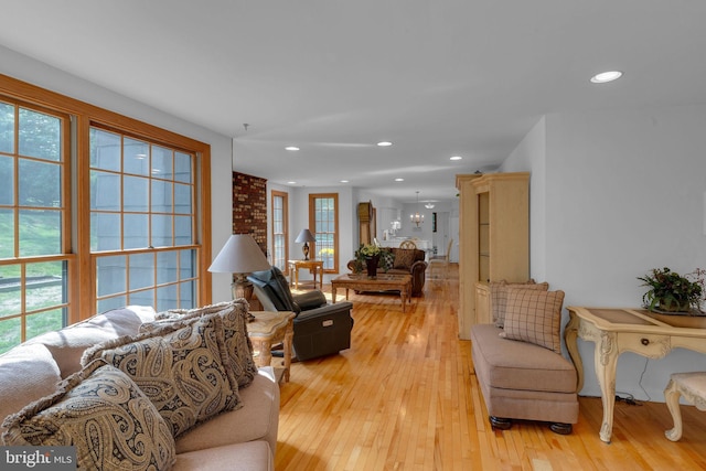 living room featuring light wood-type flooring and a wealth of natural light