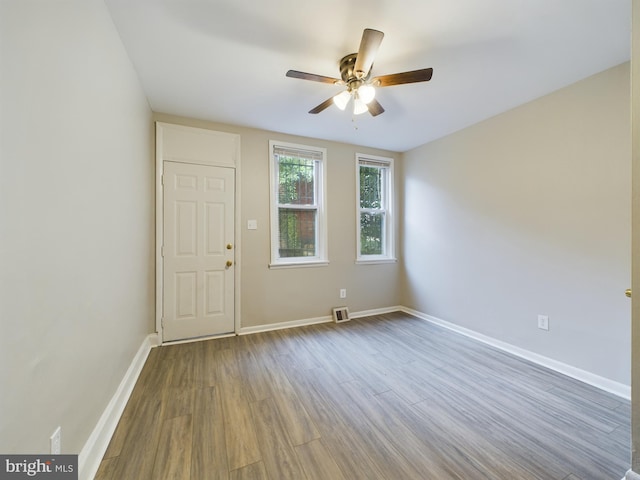 foyer with ceiling fan and hardwood / wood-style floors