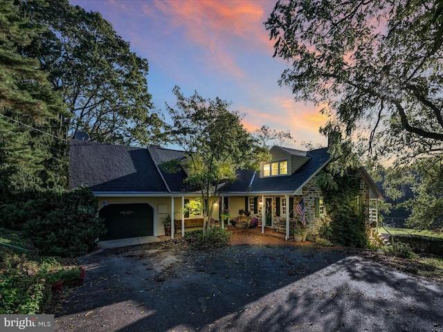 1414 Little Ln, Seven Valleys, PA 17360 - view of front facade featuring an attached garage, stone siding, and driveway