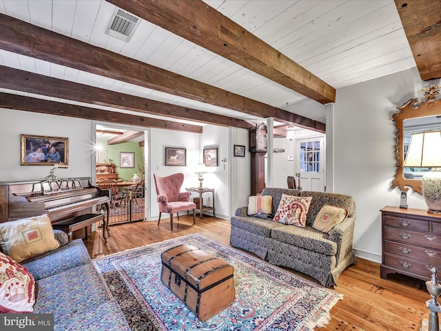1414 Little Ln, Seven Valleys, PA 17360 - living room featuring baseboards, visible vents, beamed ceiling, wood ceiling, and wood finished floors