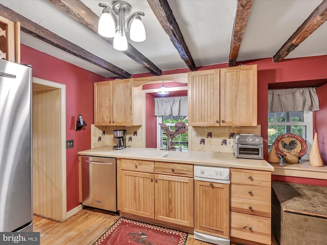 1414 Little Ln, Seven Valleys, PA 17360 - kitchen featuring appliances with stainless steel finishes, decorative backsplash, light brown cabinetry, and beam ceiling