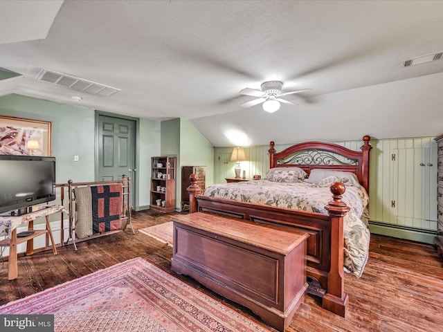 1414 Little Ln, Seven Valleys, PA 17360 - bedroom featuring a baseboard radiator, lofted ceiling, dark wood-style floors, and visible vents