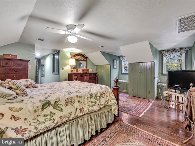 1414 Little Ln, Seven Valleys, PA 17360 - bedroom featuring visible vents, a textured ceiling, wood finished floors, and lofted ceiling