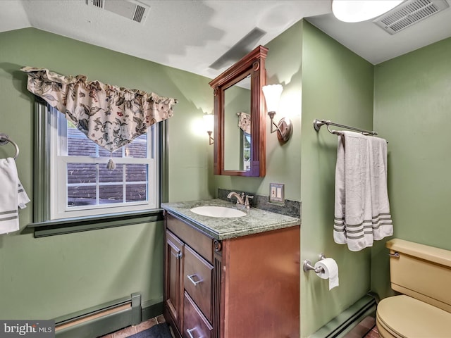 1414 Little Ln, Seven Valleys, PA 17360 - half bath featuring toilet, vanity, a baseboard heating unit, and visible vents