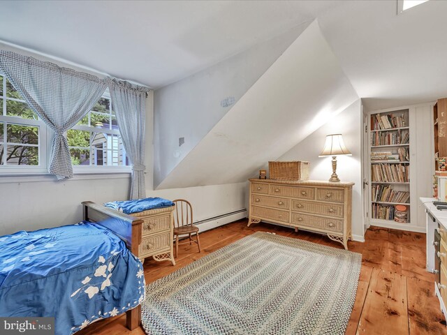1414 Little Ln, Seven Valleys, PA 17360 - bedroom featuring baseboard heating, wood-type flooring, and lofted ceiling