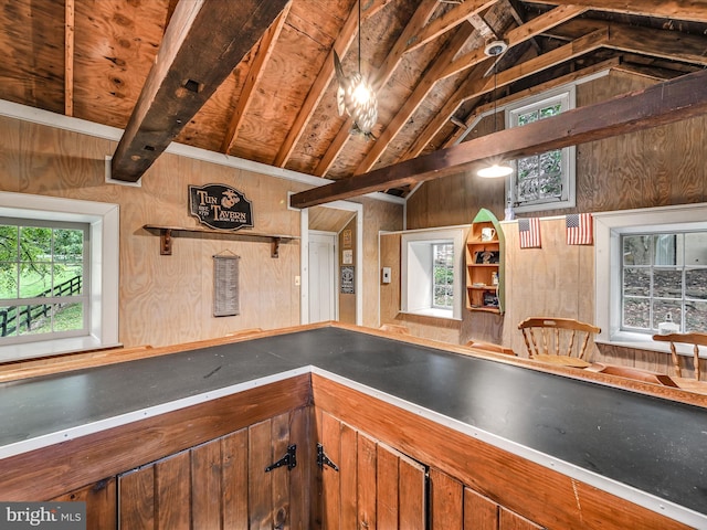 1414 Little Ln, Seven Valleys, PA 17360 - kitchen featuring wooden walls, open shelves, and lofted ceiling with beams