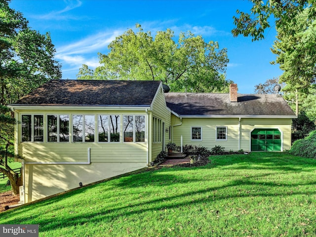 1414 Little Ln, Seven Valleys, PA 17360 - back of property featuring an attached garage, a chimney, and a lawn