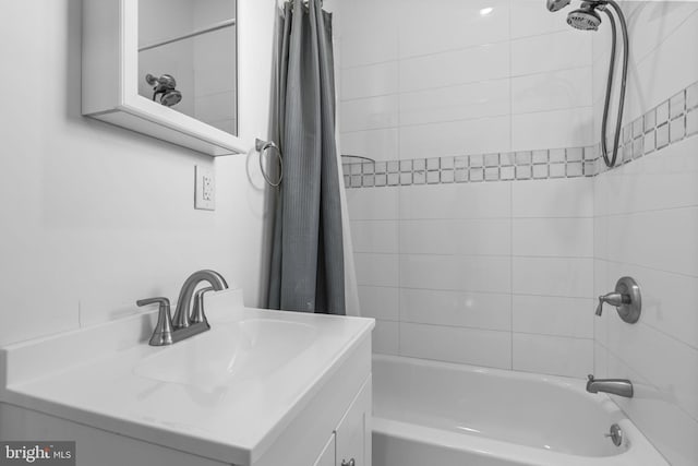 bathroom featuring vanity and shower / bath combo with shower curtain